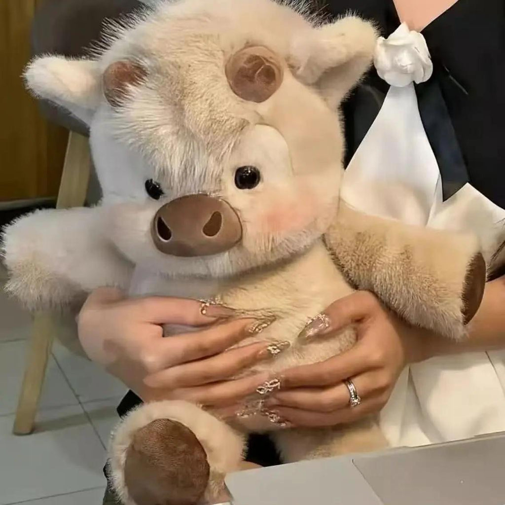 Vitello che corre in peluche